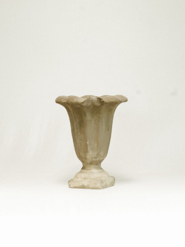 Grey stone vase against white background
