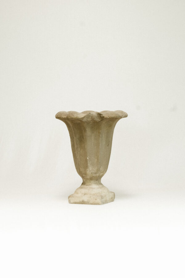 Grey stone vase against white background